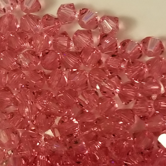 Swarovski Jewelry - 4/$75 Swarovski 3mm Bi-cone - Rose Xilion Crystal